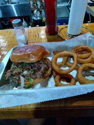 Delightful shaved steak sandwich and perfect orings