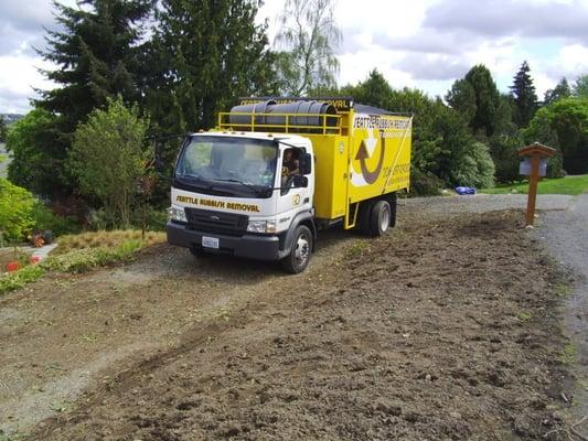 AFTER - Yard waste loaded and the area raked clean