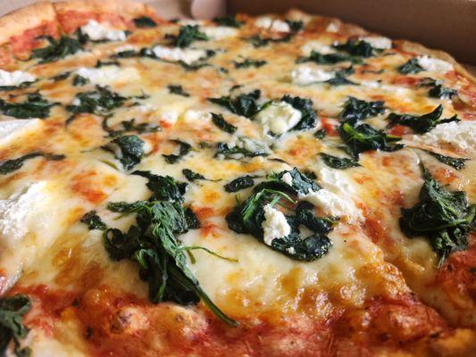 The best pizza, hands down!! White pizza with a splash of sauce, spinich, mozzarella, ricotta, and garlic!!  Perfect!!!