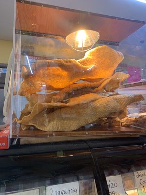 A huge chicaron (fried pork skin) in the back of the grocery