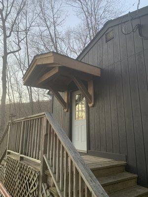 Portico roof with rough lumber from local sawmill