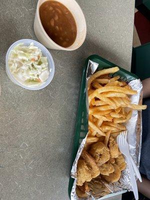 The fried shrimp plate with fries and slaw and beans.