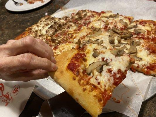 Slice of pizza with mushrooms