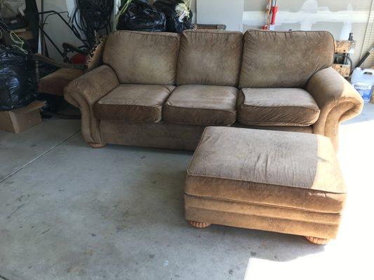 Front of the couch by Smith Brothers with 1 of 2 Hassocks.