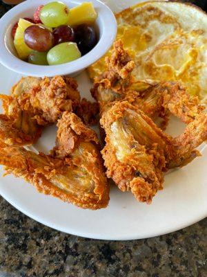 Chicken, fruit bowl, fried eggs