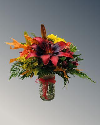 Dark moody lily tone fall color arrangement