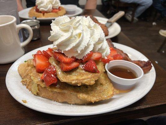 BIG French toast. I mean 4 French bread dipped slices. Everyone was looking. Fresh strawberries and  whip cream