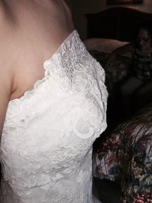 Lace is not sewn down properly and sticks out from the body. It was like this all over the dress.