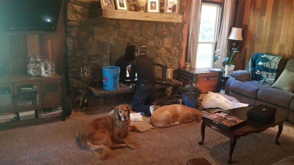 Bentley, Sage, and Mark cleaning the chimney