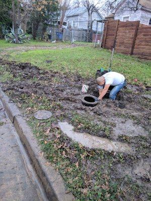 plumber fixing our water main after Splash drove a massive trailer through our yard, causing $1800+ in damage we had to pay for.