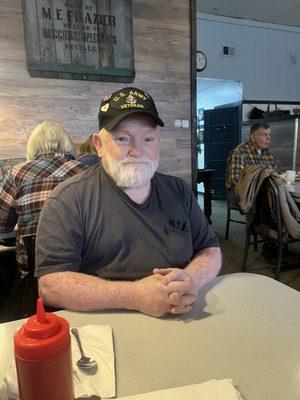 My dad waiting briefly before enjoying his delicious lunch!