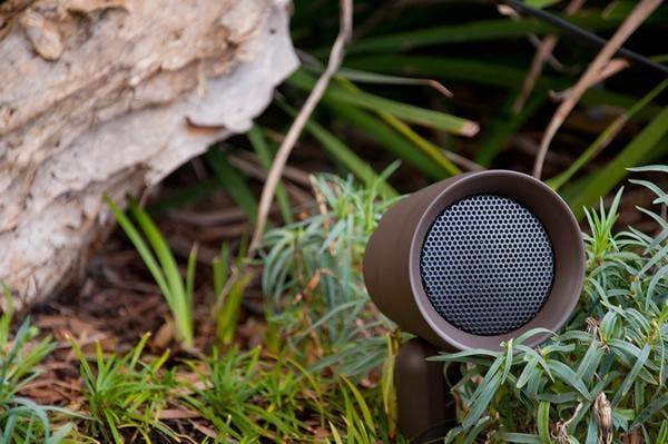 Enhance your outdoor living space with sleek speakers that blend into the landscape.