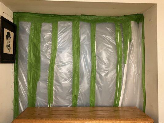 Curtains,  four blankets, one comforter, plastic and tape to prevent cold air and heat from coming inside home.