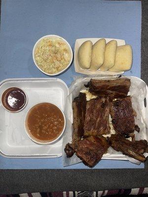 Rack Pack... Rack of Ribs, BBQ Sauce on the side, 2 Large Size Dinner Sides (Baked Beans & Coleslaw "Vinegar" base), 4 Dinner Rolls.