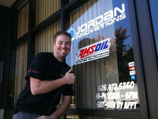 Jeff Jordan (founder and co-owner) in front of their new window vinyl!