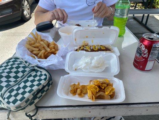 Cheese fries, coney dog, veggie dog with Cajun Fritos topped with melted cheese.