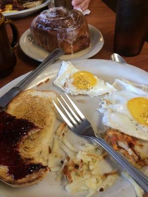 The "lighter side" two eggs, the space that used to be a half order of has Browns, slice of sourdough toast and cinnamon roll.