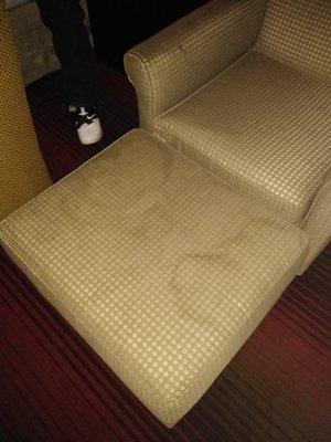 Close-up of stains on chair ottoman