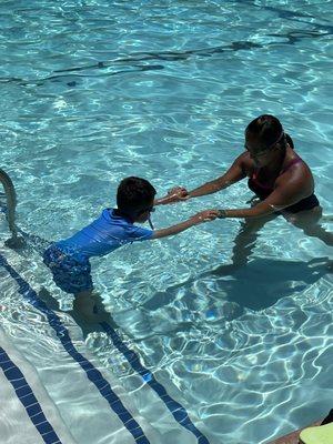 Enjoying first swimming lesson