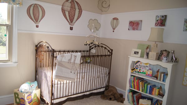 Up, Up and Away baby nursery. Gender neutral palette. Craigslist finds as well as re-purposing of bookcase.