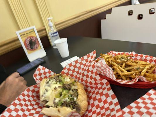 Pepper Onion Cheesesteak Sandwich (Belly Buster) and 56. Large Garlic Fries