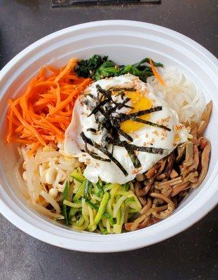 Vegetable bimbimbap before mixing, with the rice that came in a separate container. Everything very fresh and delicious.