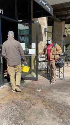 5th Street Services plumbers walking into Max's Wine & Dine for repairs