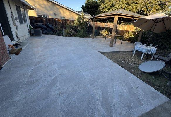 Backyard renovation: An existing patio was extended and tiled, and a gazebo was added.