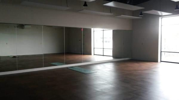 Large practice room with sustainable, and antimicrobial cork flooring.