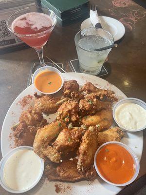 Dozen wings with sauces on the side: buffalo, ranch, siracha, and blue cheese