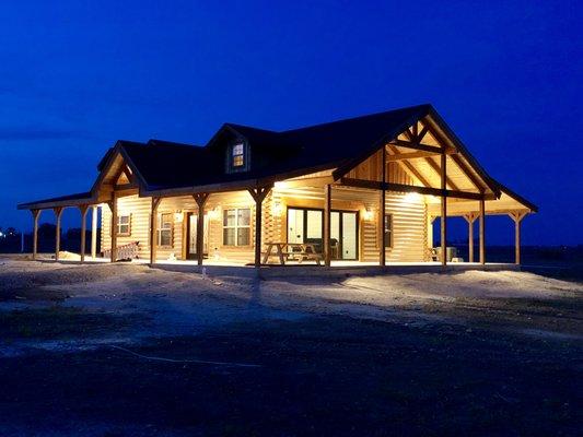 Log house and event center at night