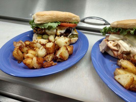 The burger with bugger with home style potatoes and the Malibu chicken sandwich