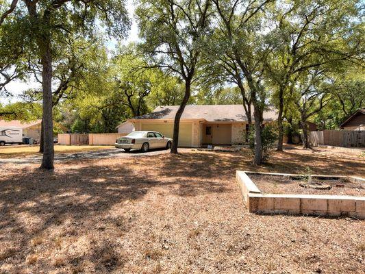 Wow! Investor priced property north of Austin. Large yard w/Double gate for RV, boat, etc., has outbuildings and big workshop. FEB 2019