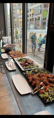 Catering at the corner alley. Chicken tenders, wings, salad