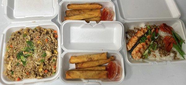 Left to right. Chicken fried rice. Middle pork and chicken lumpia. Right is salmon teriyaki over rice.