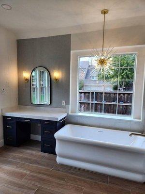 Modern bathtub with giant window and custom made vanity area