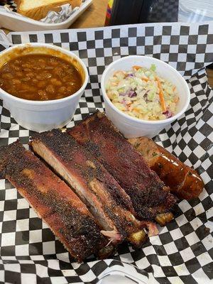 The 3 rib plate with sides of bbq beans, coleslaw and sausage.