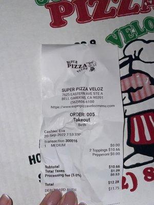 The receipt says two toppings