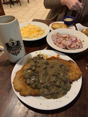 Jaegerschnitzel - The portion is so huge sit covering the delicious sides - brown-sugared carrots and homemade noodles. So Good!