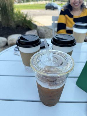 Three Chai Latte and my iced coffee. My cousin in the background enjoying hers.