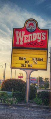 sign welcoming people to Wendy's and hiring