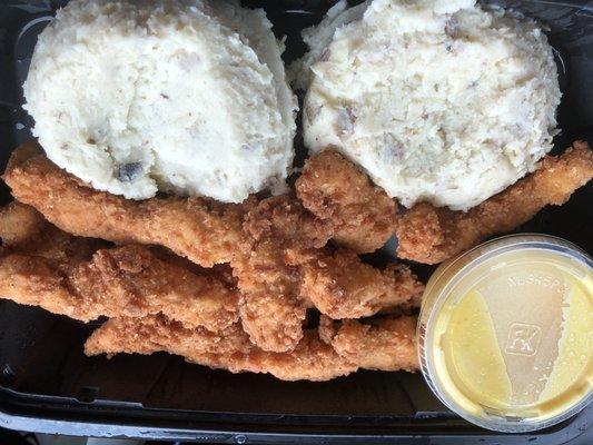 Chicken tenders with mashed potatoes and honey mustard dinner.