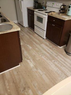 Mannington Restoration laminate gave this condo a relaxing beachy feel!