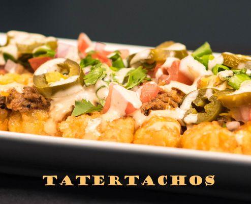 Tatertachos - Tater tots covered in spicy Pulled Pork, Tomatoes, Red & Green    Onions, Bacon, Queso and Jalapeno Ranch.  Topped w/Cilantro