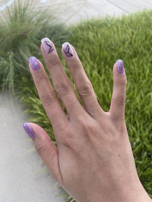 Gel manicure with butterfly design done with Tara