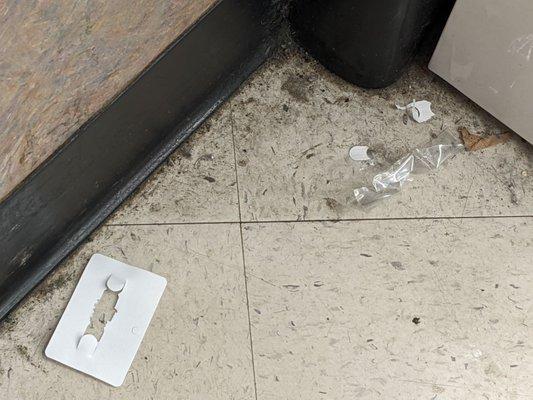 In front of the pharmacy, inside the store. The rest of the store is equally filthy.