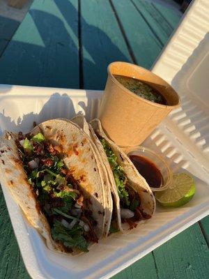 Beef Barbacoa Tacos with broth, served with onion, cilantro and my own hibiscus-chipotle salsa.