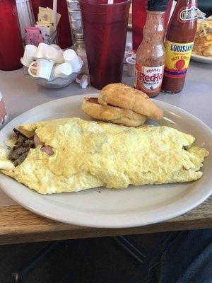 Meat lover's omelet with biscuit