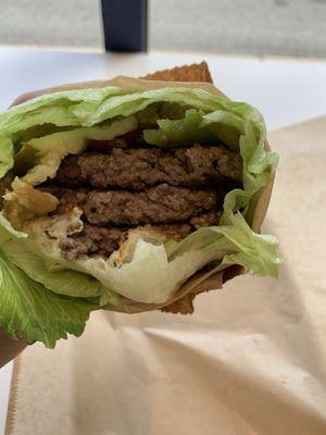 Burger wrapped in lettuce.