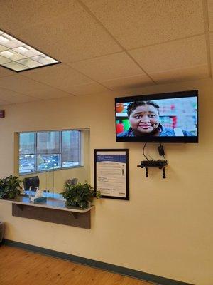 Check-in window area with TV